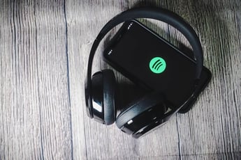 Spotify on phone with headphones
